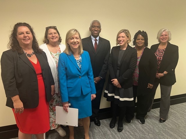 King and others stand before a presentation to the N.C. House Select Committee on Advancing Women in STEM the