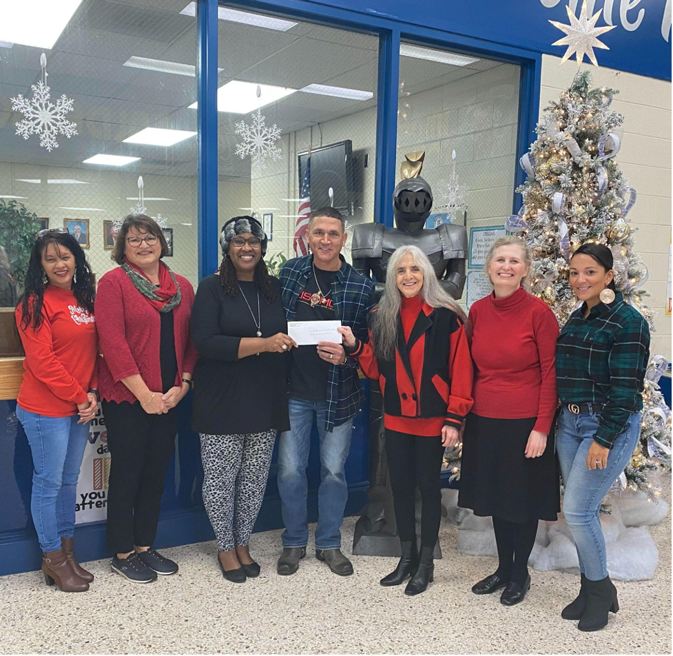Burnt Swamp Baptist Association member Anthony Dial presents check to L. Gilbert Carroll Middle School Staff
