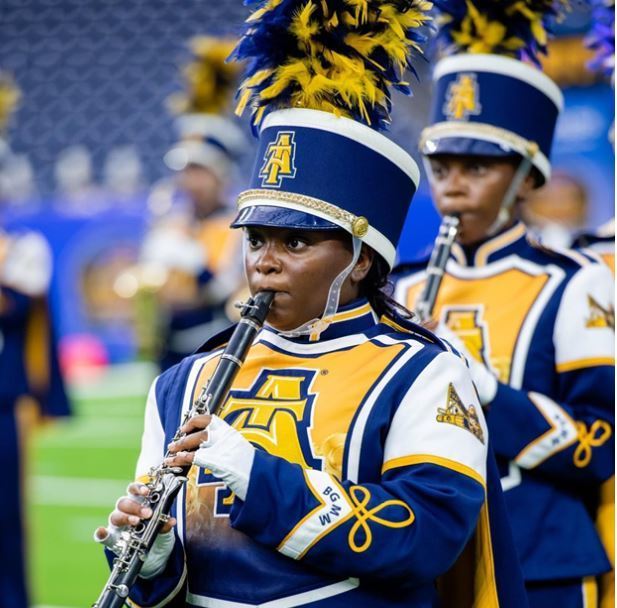 Paige marches in NC A&T State University Blue and Gold Marching Machine